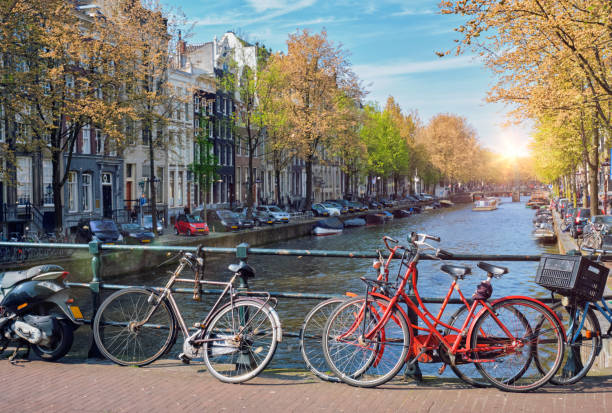 istock Amterdam canal, bridge and medieval houses 930915850