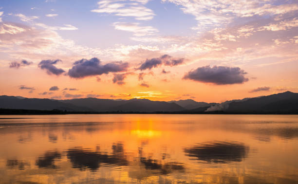 istock Reflection of cloud and twilight sky over clear lake 930926220