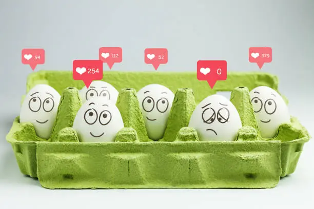 Photo of Happy eggs with many likes, one sad egg without likes.