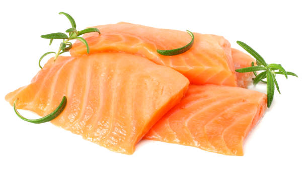 istock Red fish. Raw salmon fillet with rosemary isolate on white background 930930660