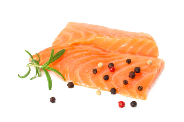 istock Red fish. Raw salmon fillet with rosemary isolate on white background 930930674