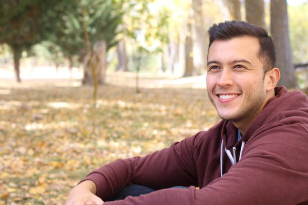 istock Mixed race male smiling in the fall with copy space 930930978