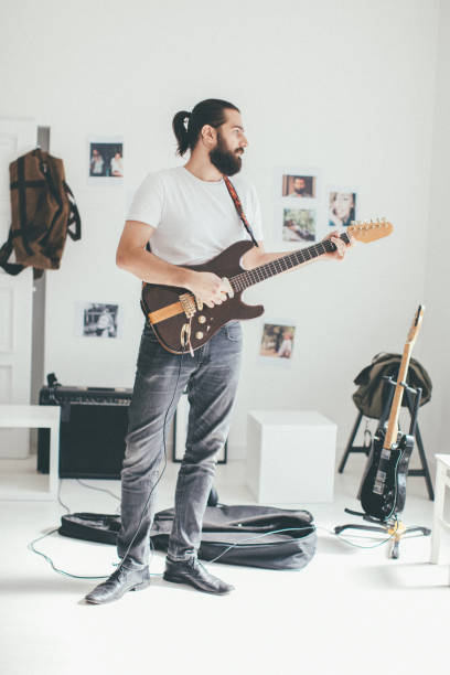 istock Man playing electric guitar 930933988
