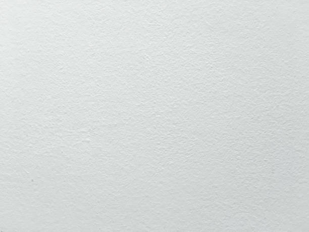 istock Grungy painted wall texture as background. Cracked concrete vintage wall background, old white painted wall. Background washed painting. 930934042