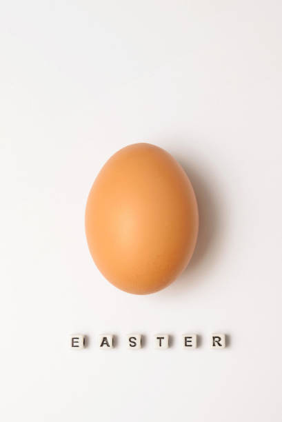 istock Chicken egg on a white background with an Easter inscription 930934058