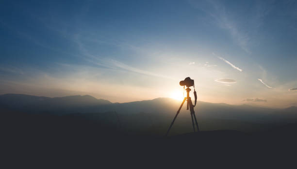 Silhouette of a camera on a tripod