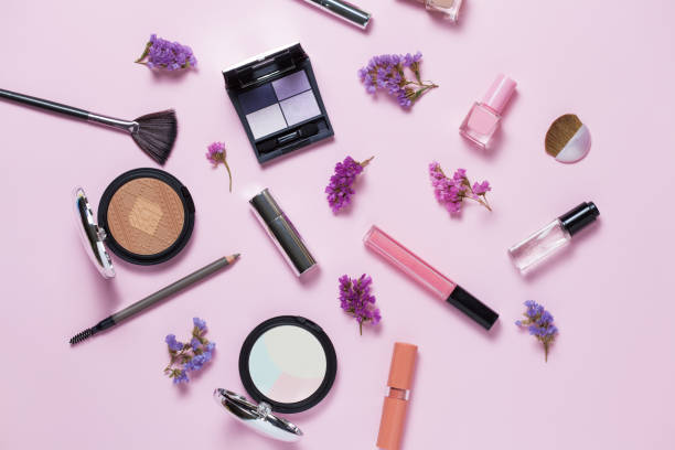istock Beauty, decorative cosmetics. Makeup brushes set and color eyeshadow palette on pink and blue background , flat lay, top view, Minimalistic style 930936656