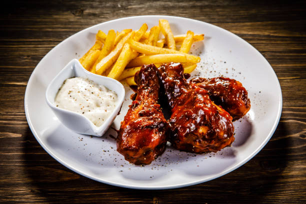 istock Fried chicken drumstics with French fries 930940218