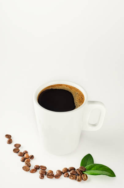 istock A cup of coffee with coffee beans on white background 930943688