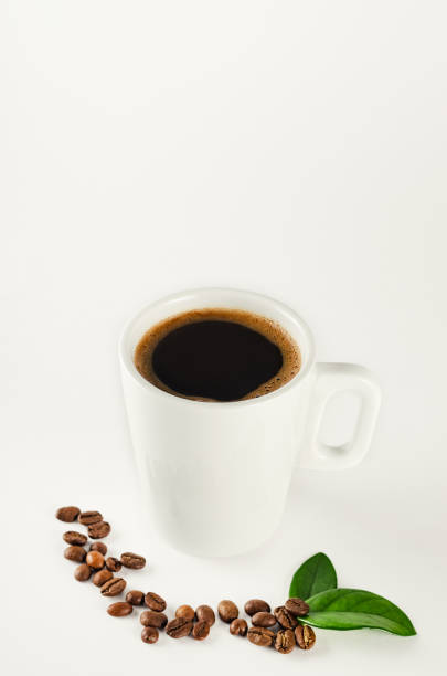 istock A cup of coffee with coffee beans on white background 930943694