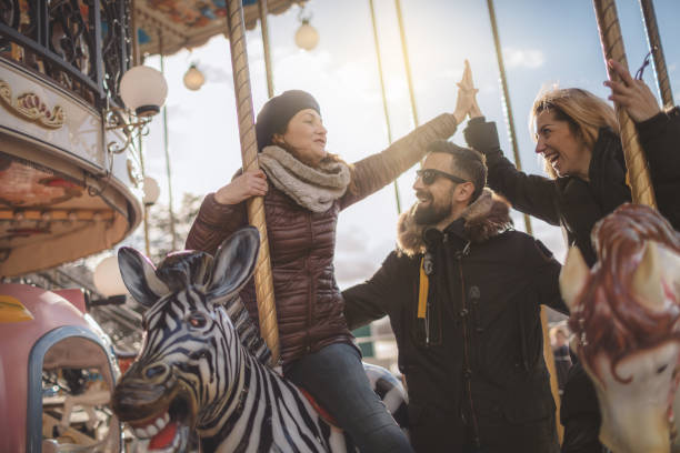 istock Friends having fun on Carousel at Paris 930944074
