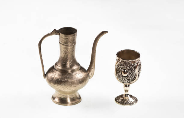 ancient Arabic silver teapot on white isolated background