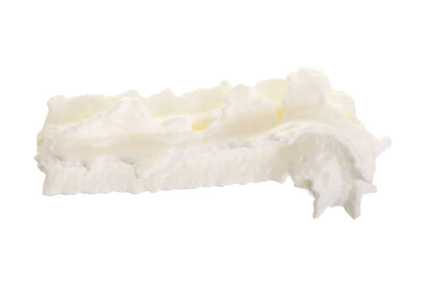 istock whipped cream or meringue isolated on white background. Top view. Flat lay 930947116