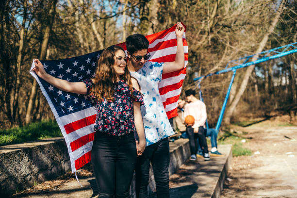 istock Young couple with American flag 930947916