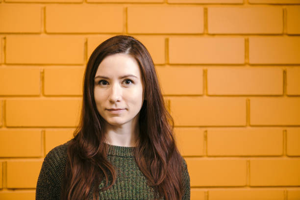 istock Portrait on a yellow brick wall 930956274