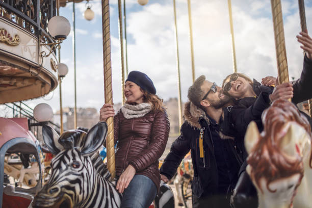 istock Friends having fun on Carousel at Paris 930956390