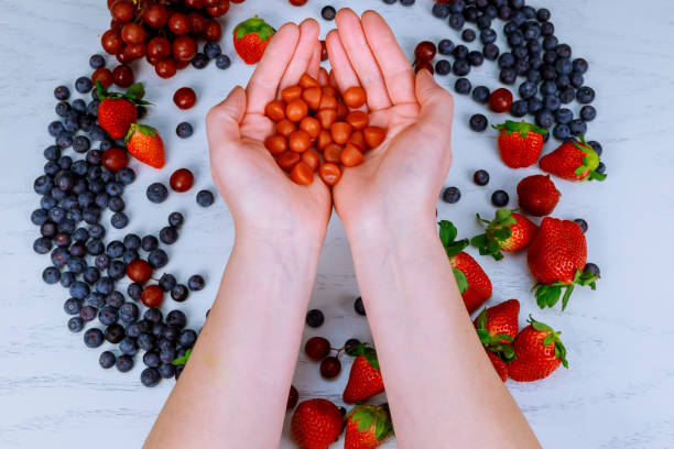 istock multivitamin supplements from fruit on white wooden background 930957064