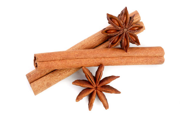istock Cinnamon sticks and star anise isolated on white background. Top view 930961746