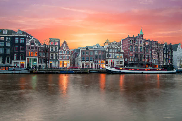 Amsterdam at the river Amstel at sunset in the Netherlands