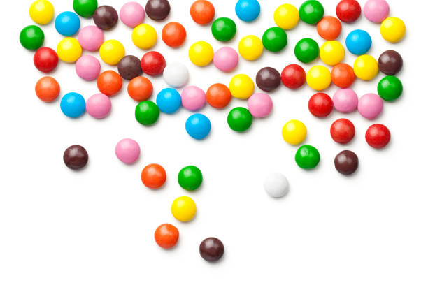 istock Colorful Chocolate Candy Pills Isolated on White Background 930975338