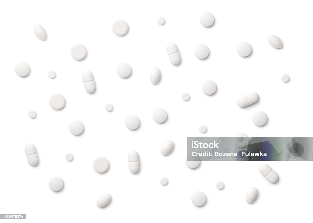 White Pills Isolated on White Background White pills isolated on white background. Copy space. Top view Pill Stock Photo