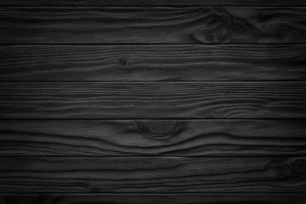 istock black wooden abstract background with light and scratches, dark wood texture 930984676