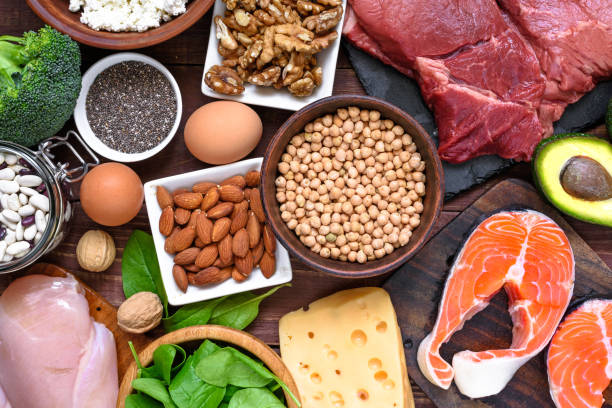 High protein food - fish, meat, poultry, nuts, eggs and vegetables. healthy eating and diet concept High protein food - fish, meat, poultry, nuts, eggs and vegetables. healthy eating and diet concept. top view paleo diet stock pictures, royalty-free photos & images