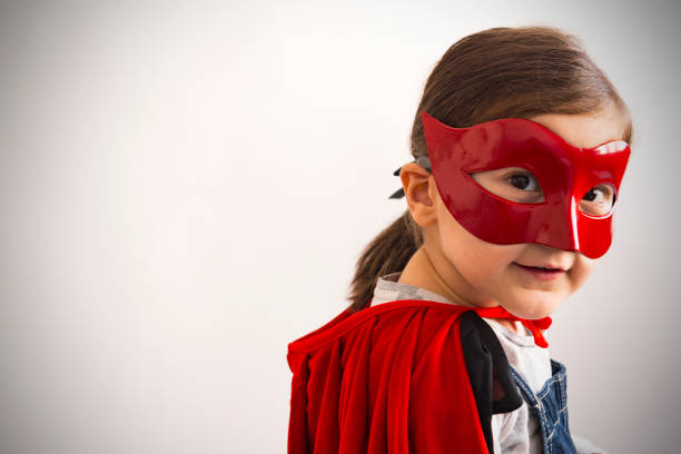 Portrait of a senior woman in black cloth decorated with red lace. She is Smalling while  attending a seniors people carnival party in Ljubljana, Slovenia.