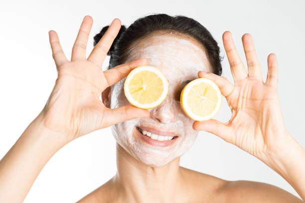 istock Woman holding lemon slices over eyes 930988412