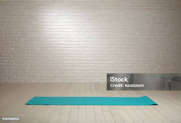 Empty Room Background Wooden Floor White Brick Wall Fit Mat Stock Photo - Download Image Now