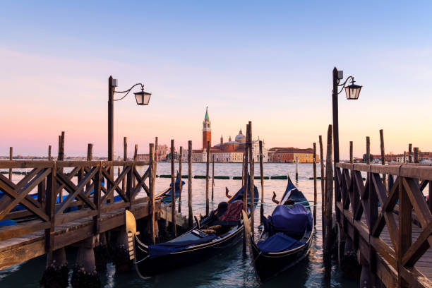 istock Venice with famous gondolas  in lagoon at sunrise 931003958