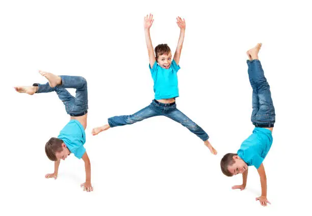 Young boy doing exercise with a white background