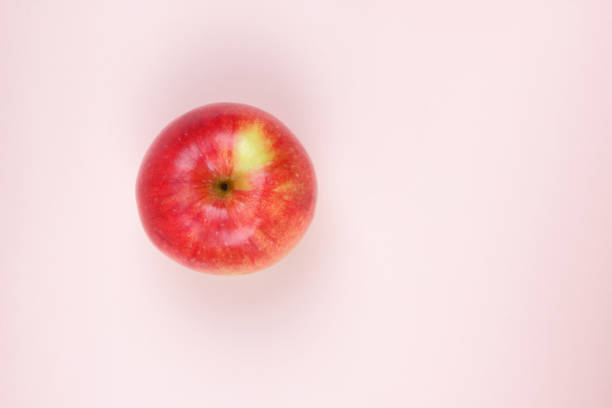 istock Apple, fruit pop art, red apple on a pink background, fruit for breakfast, vitamins, vegetarian food, pastel background, minimalism, blank for a designer, Asian food, American breakfast 931004226