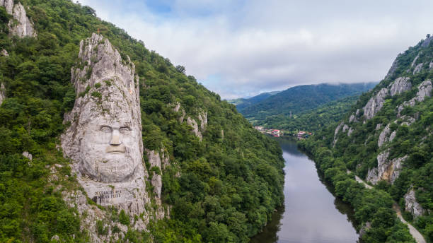 Decebal Head sculpted in rock stock photo