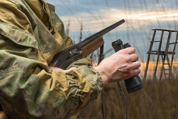 istock Man hunting with a hunting rifle. Copy space 931006702