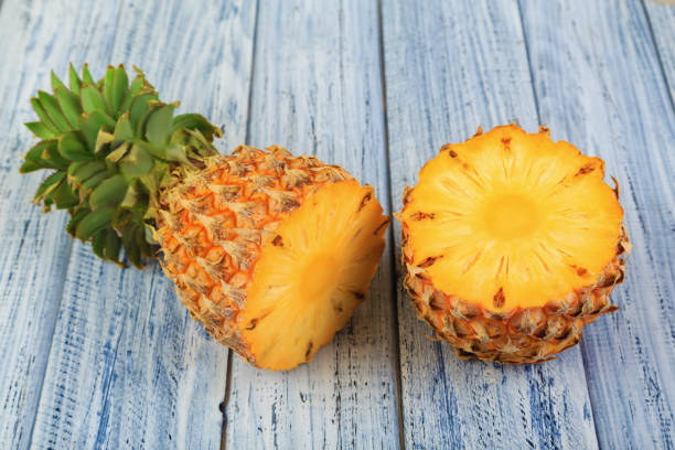 istock two halves of pineapple, cuted ripe pineapple 931015718