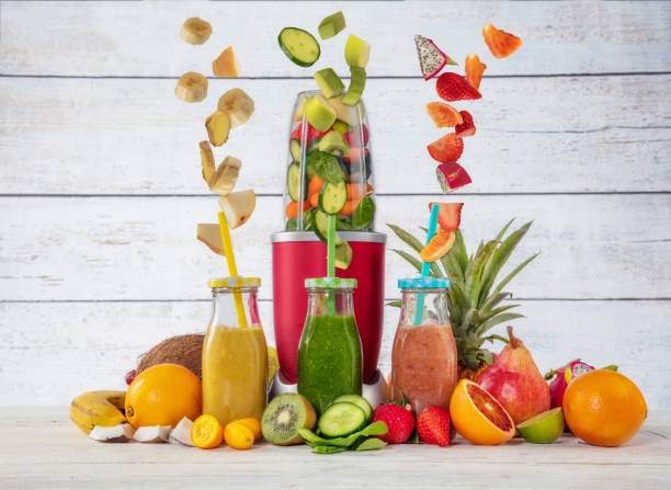 istock Smoothie maker mixer with pieces of fruit ingredients 931015768