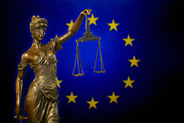 istock Lady Justice before the European Union flag 931018720