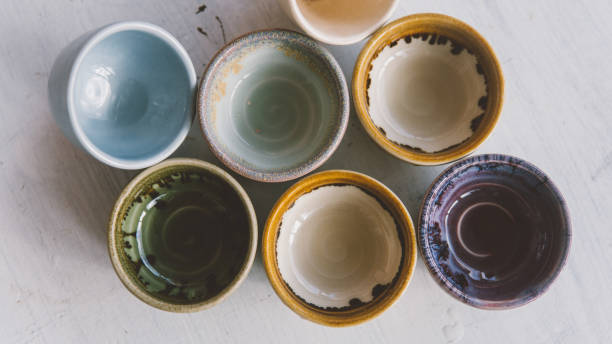 istock clay tea cups on a white background close-up. Natural ceramic ware for drinks. 931019276