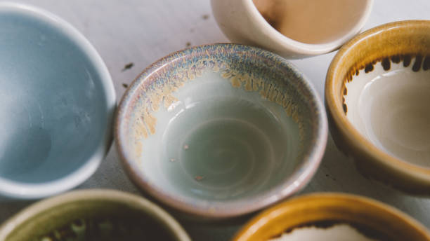 istock clay tea cups on a white background close-up. Natural ceramic ware for drinks. 931019288