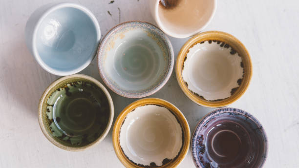 istock clay tea cups on a white background close-up. Natural ceramic ware for drinks. 931019296
