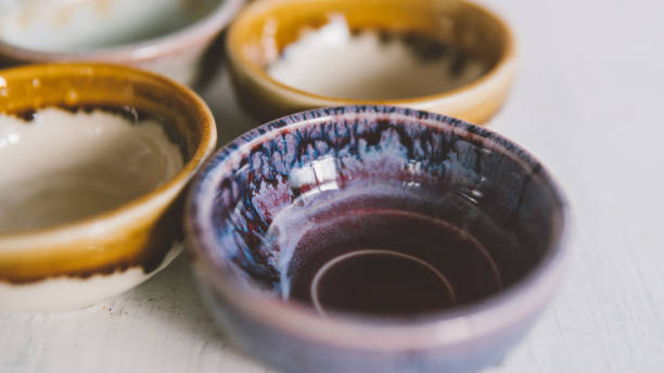 istock clay tea cups on a white background close-up. Natural ceramic ware for drinks. 931019304