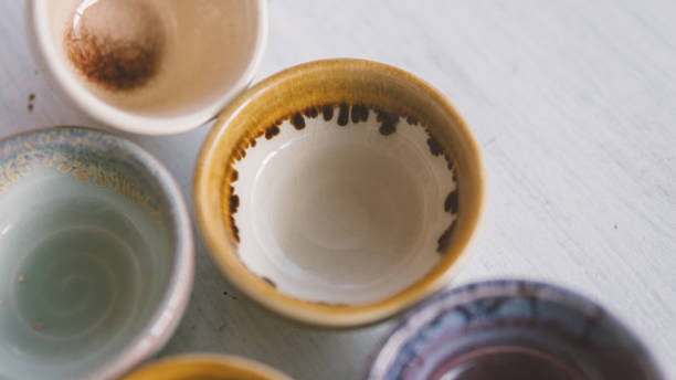 istock clay tea cups on a white background close-up. Natural ceramic ware for drinks. 931019320