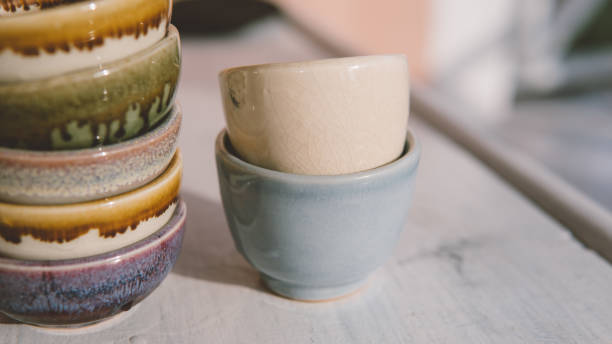 istock clay tea cups on a white background close-up. Natural ceramic ware for drinks. 931019350