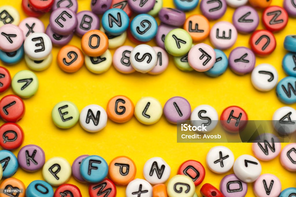 English word composed from colorful abc alphabet block wooden letters, copy space for ad text. Education concept. English word composed from colorful abc alphabet block wooden letters, copy space for ad text. Education concept English Language Stock Photo