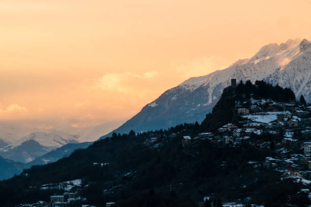 APRICA, ITALY - January, 2018. Sunset over the village of Teglio in Valtellina in winter with snow