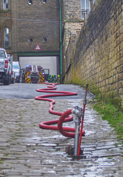 Paramedics and Firefighters Working at Fire Incident stock photo