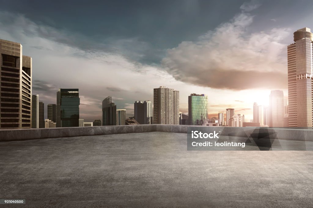 Rooftop balcony with cityscape Rooftop balcony with cityscape at sunset Rooftop Stock Photo