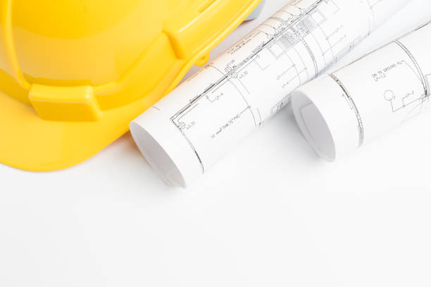 istock office desk with helmet on white background 931040588