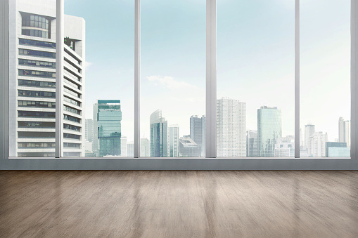 Empty office room with wooden floor